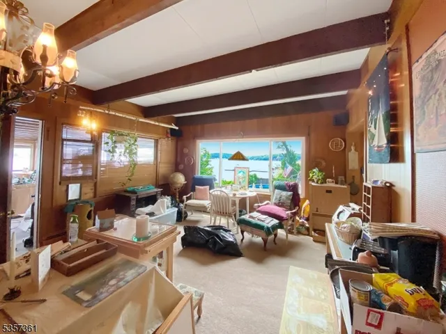 a living room with furniture a lamp and a potted plant