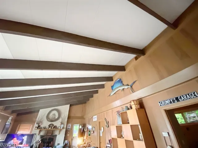 a metallic refrigerator freezer sitting in a kitchen