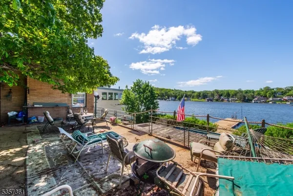 a view of a backyard with sitting area