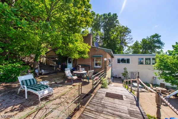 a bird view of house and outdoor space