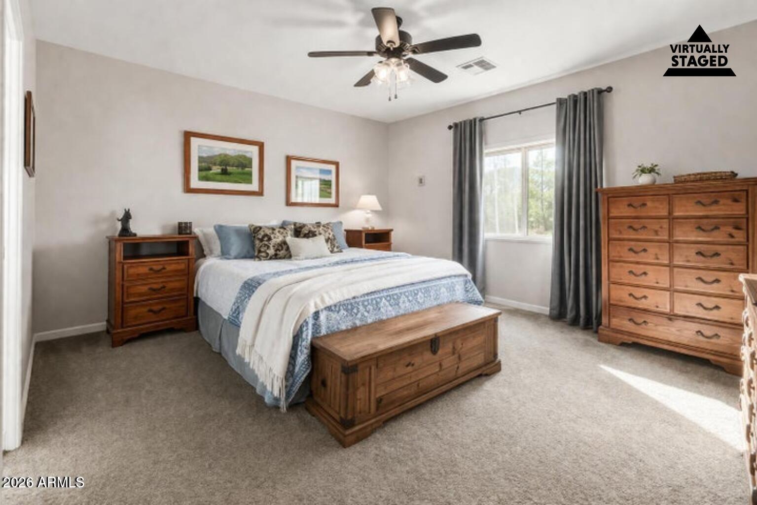 614 North Tomahawk Road Apache Junction, AZ 85119 - Photo 13 of 44 a bedroom with a bed and a dresser
