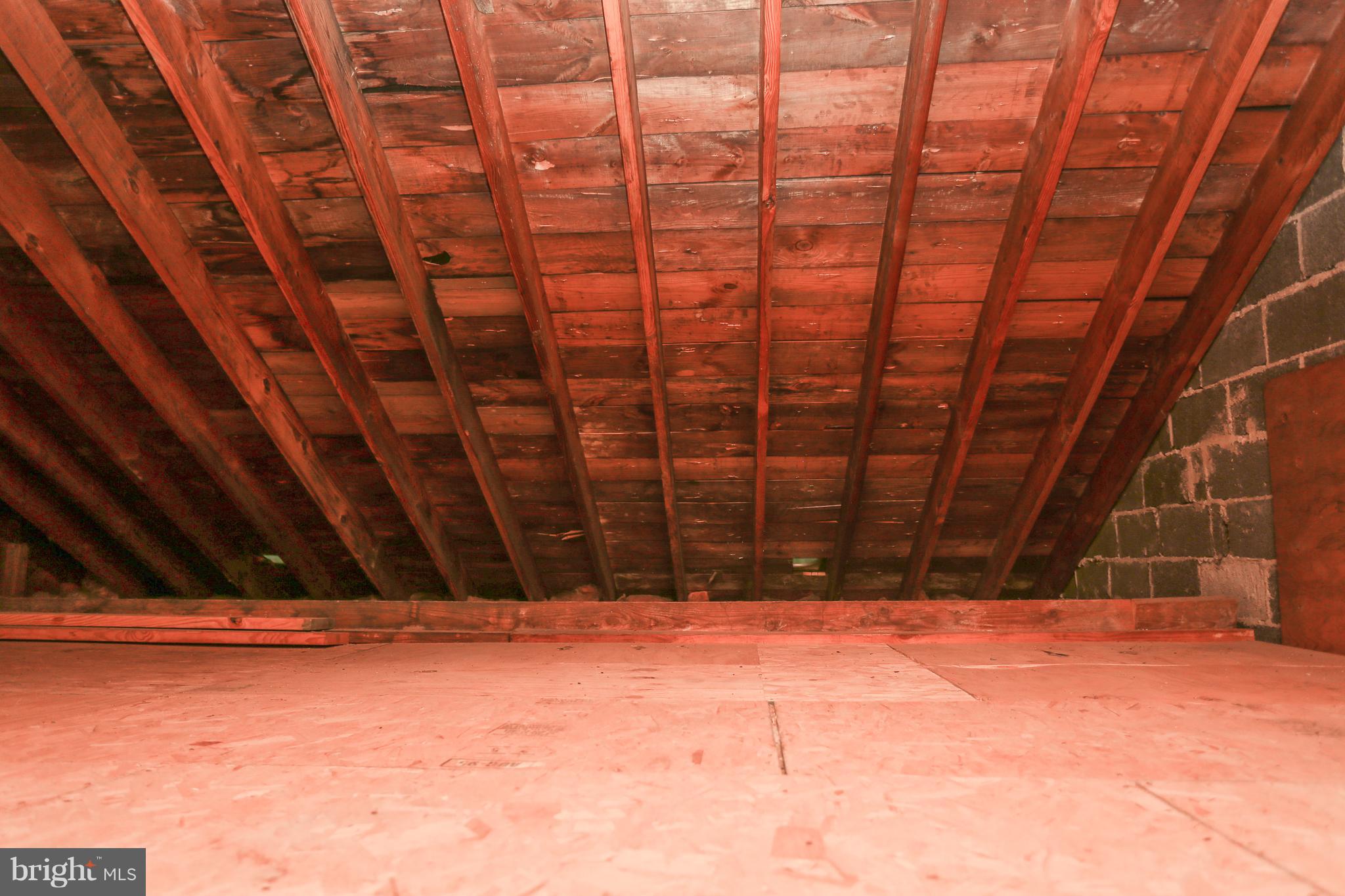 1034 Downton Road Baltimore, MD 21227 - Photo 36 of 48 Great lighted storage space in the attic