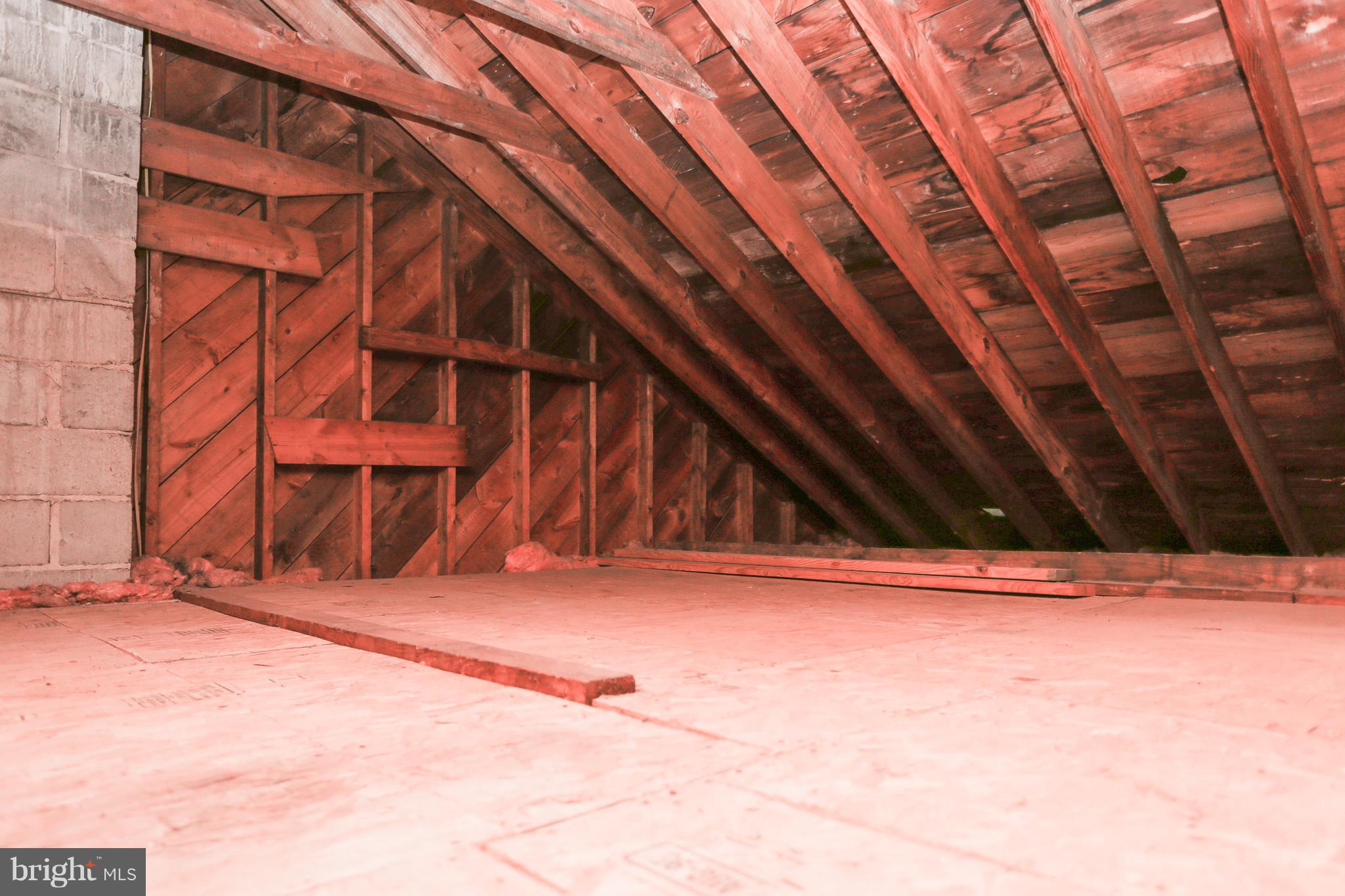 1034 Downton Road Baltimore, MD 21227 - Photo 37 of 48 Great lighted storage space in the attic