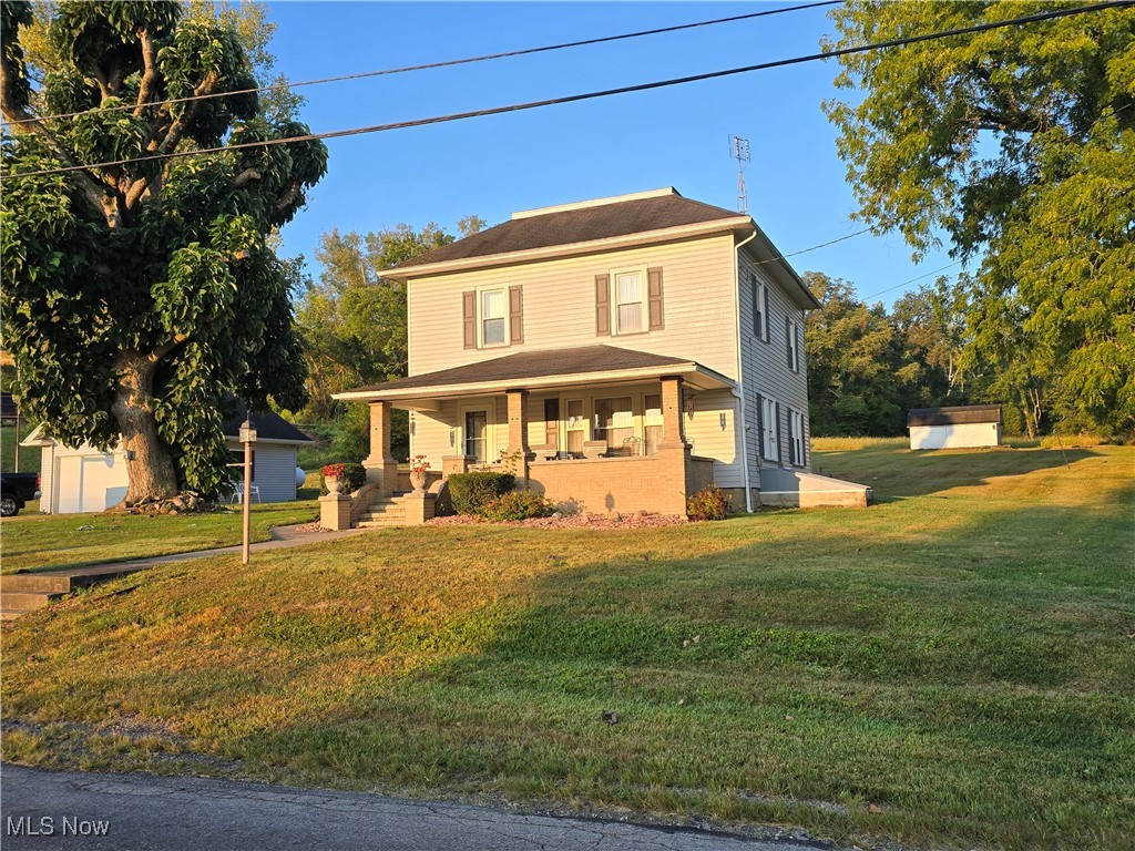 3889 South Funk Road Wooster, OH 44691 - Photo 17 of 17 View of front of house with a porch and a front lawn