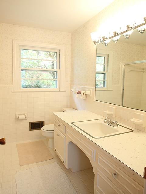 6700 Johnsdale Road Raleigh, NC 27615 - Photo 8 of 14 a bathroom with a sink and a mirror