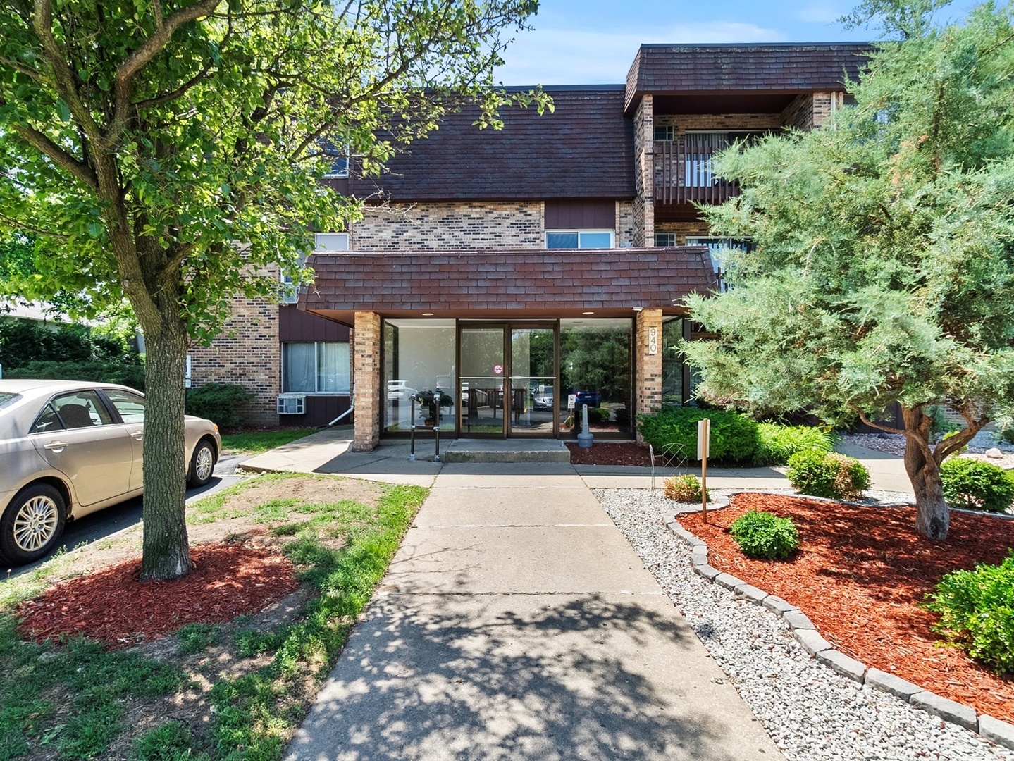 940 East Old Willow Road, Unit 305 Prospect Heights, IL 60070 - Photo 1 of 18 a view of a patio with table and chairs under an umbrella