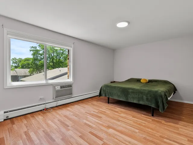 a room with a bed and a window
