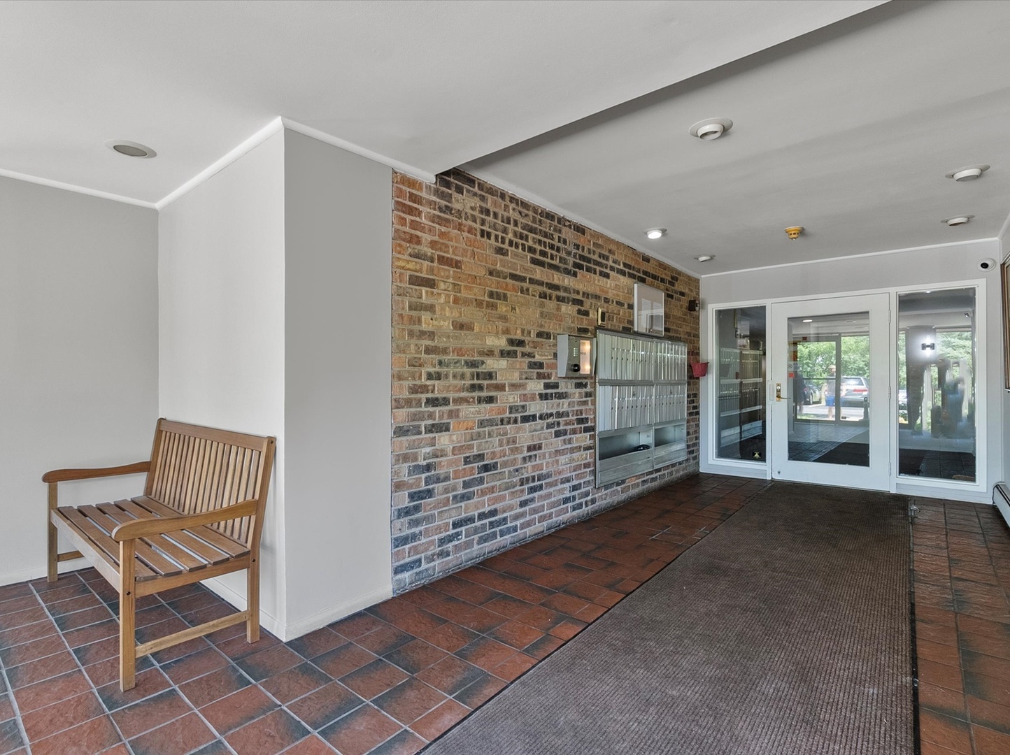 940 East Old Willow Road, Unit 305 Prospect Heights, IL 60070 - Photo 3 of 18 a view of livingroom with window and hardwood floor