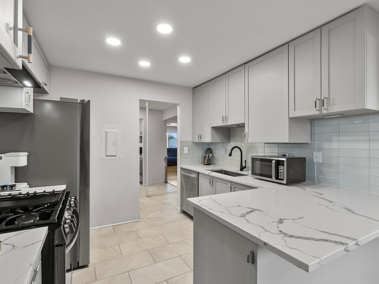 940 East Old Willow Road, Unit 305 Prospect Heights, IL 60070 - Photo 7 of 18 a kitchen with stainless steel appliances granite countertop a sink stove and refrigerator