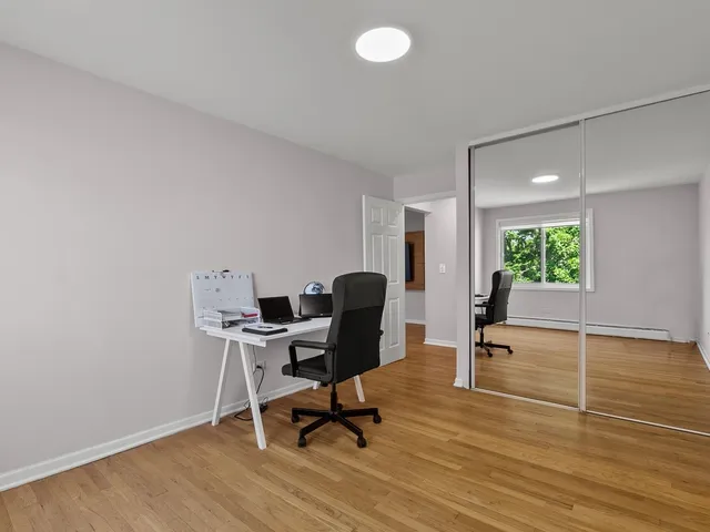 a workspace with furniture and a window