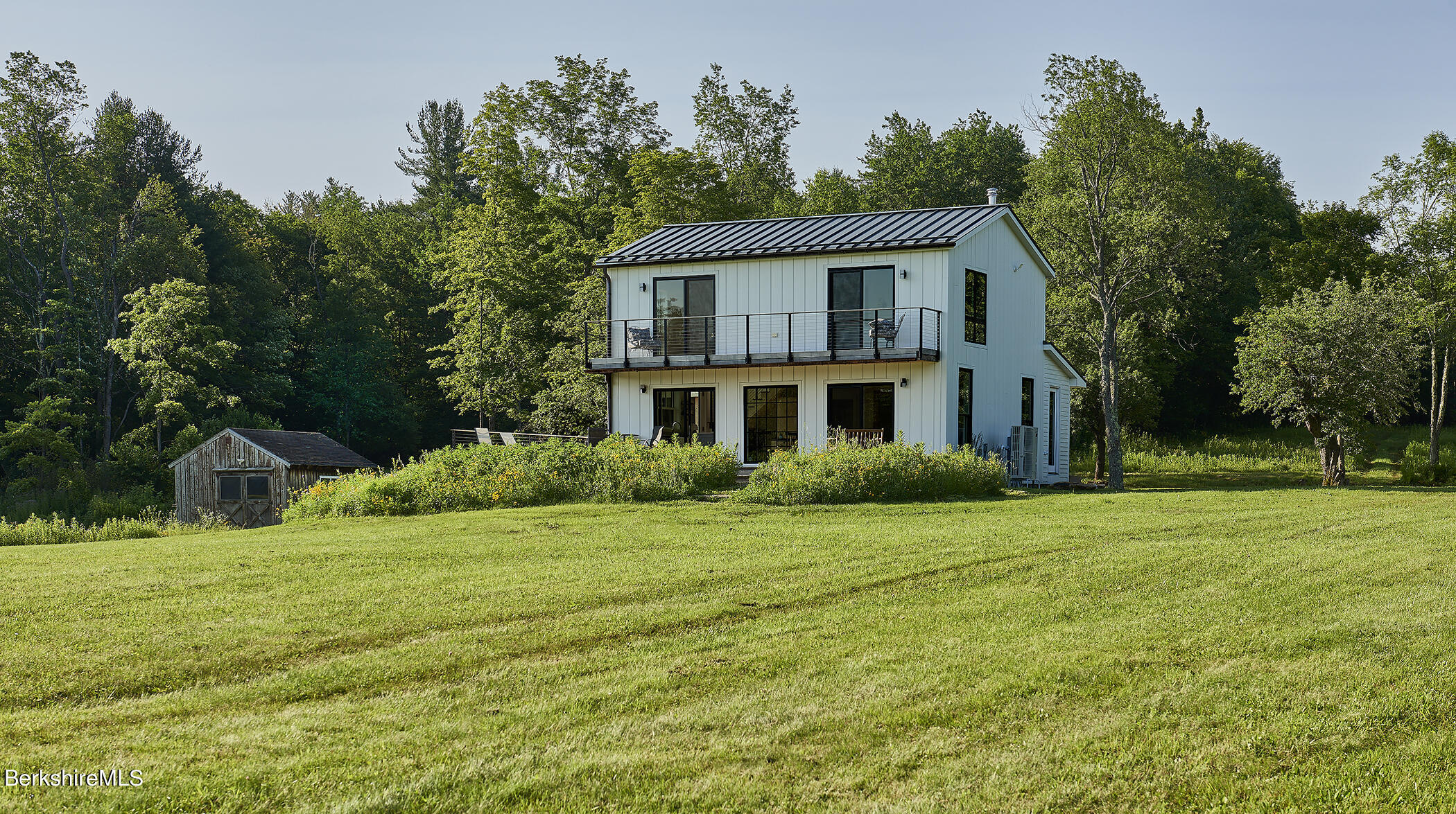 776 Bancroft Road Becket, MA 01223 - Photo 33 of 40 a front view of a house with a yard