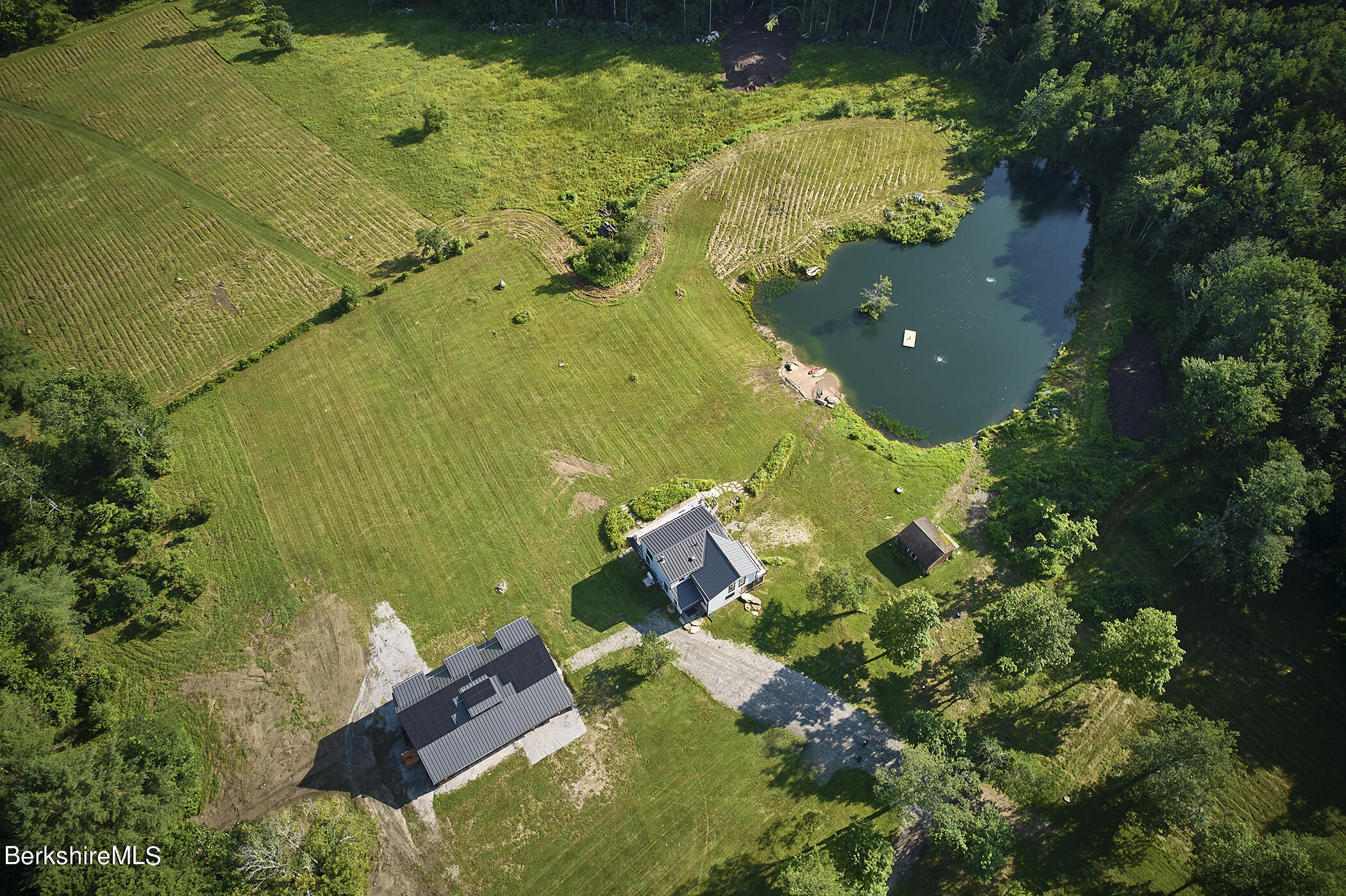 776 Bancroft Road Becket, MA 01223 - Photo 39 of 40 an aerial view of a house with a yard swimming pool and outdoor seating