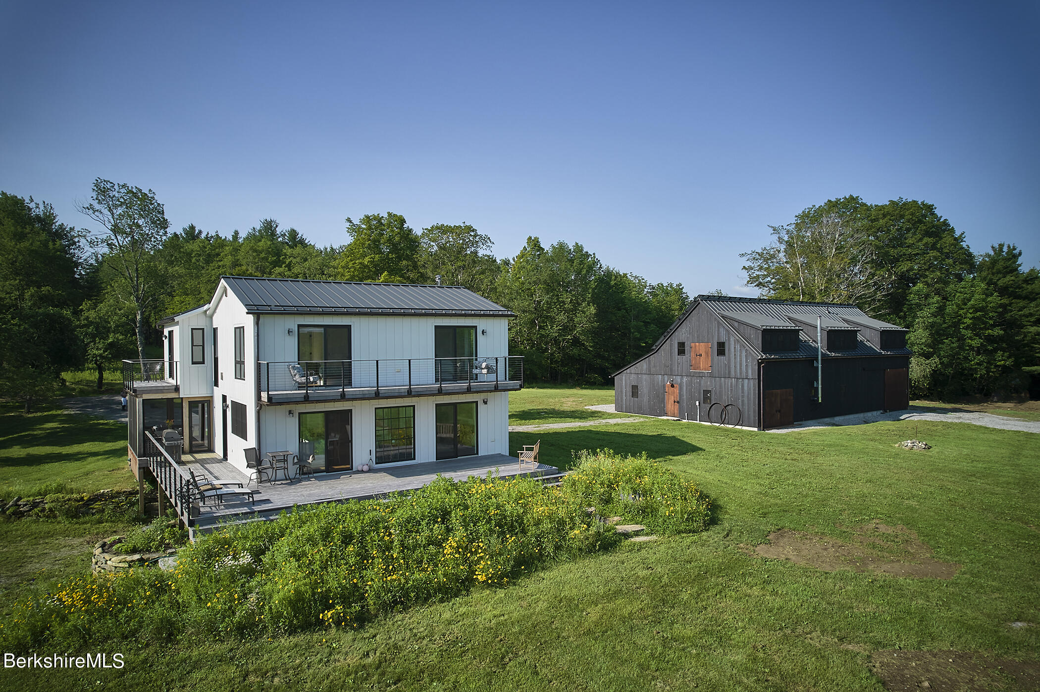 776 Bancroft Road Becket, MA 01223 - Photo 5 of 40 a house view with a garden space