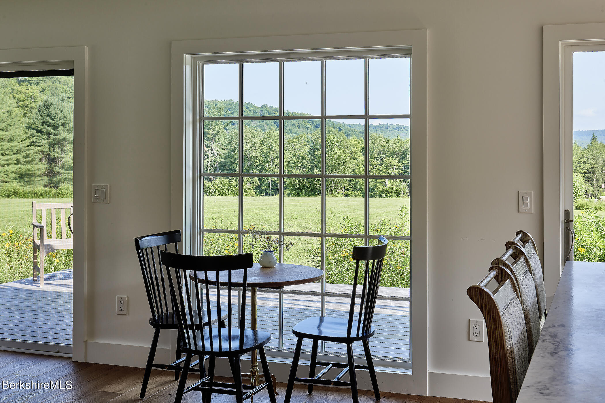 776 Bancroft Road Becket, MA 01223 - Photo 9 of 40 a view of a dining room with furniture window and wooden floor