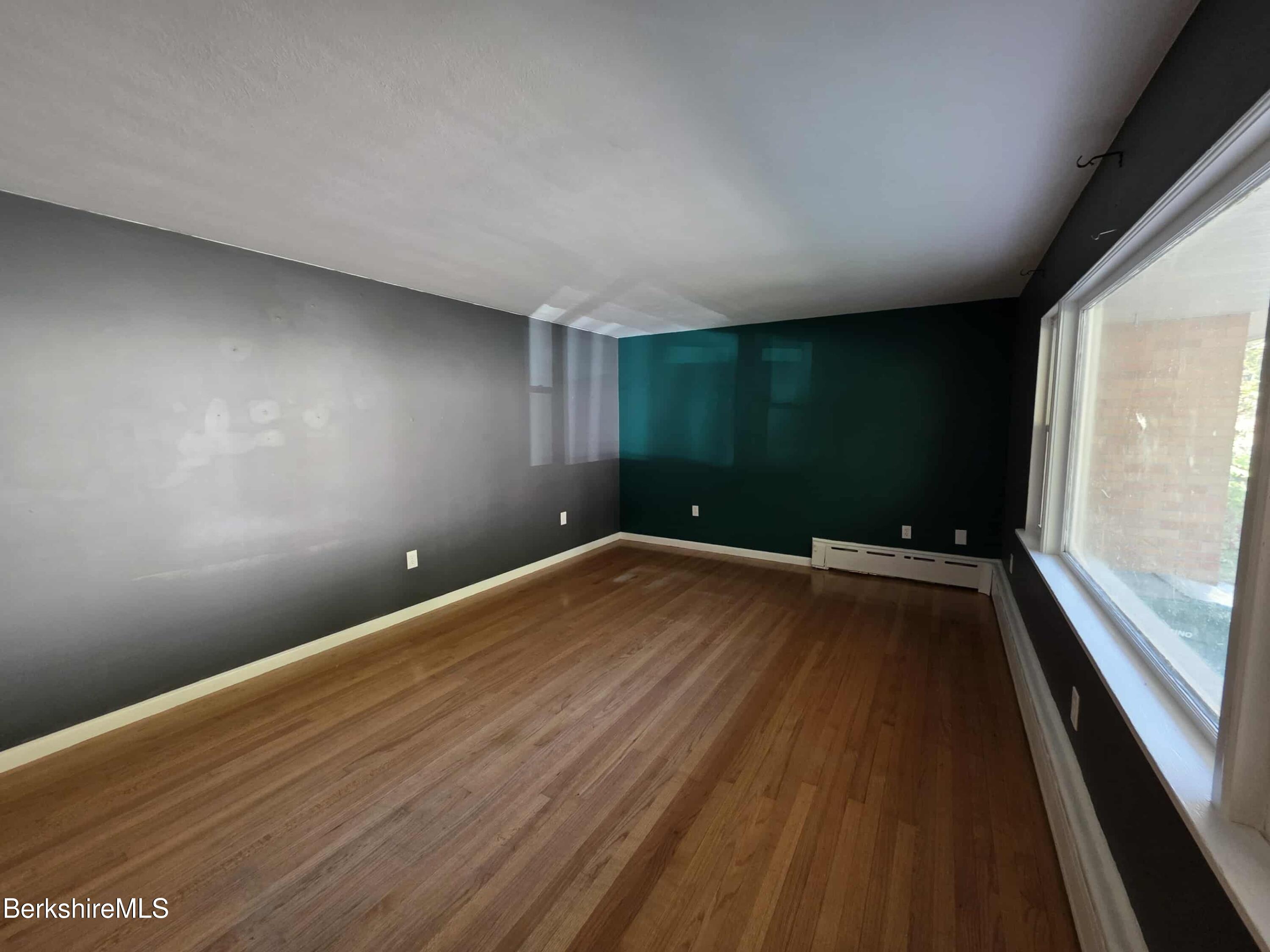 52 Richmond Street Adams, MA 01220 - Photo 12 of 25 a view of room with window and wooden floor