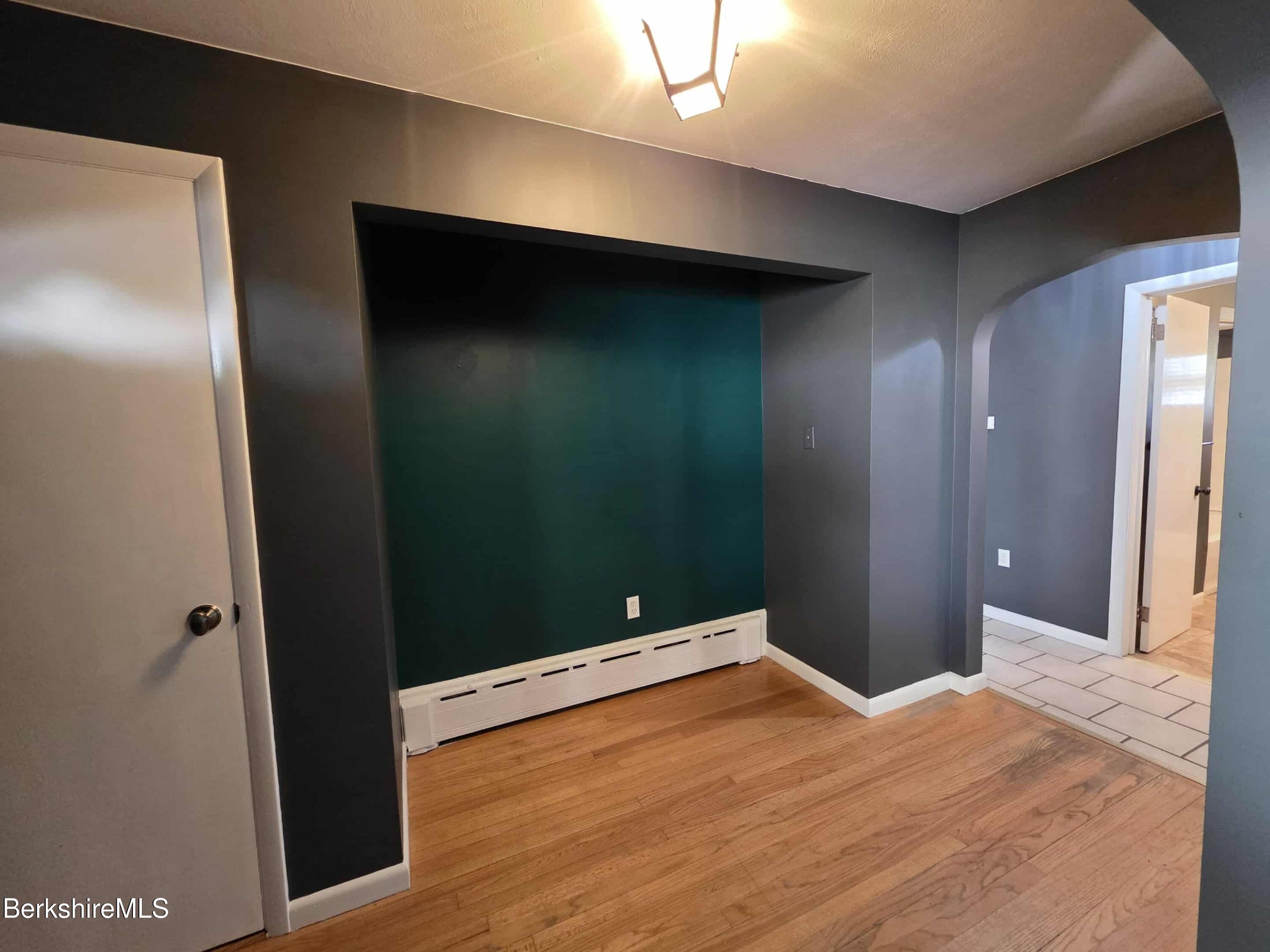 52 Richmond Street Adams, MA 01220 - Photo 13 of 25 a bedroom with a bed and wooden floor