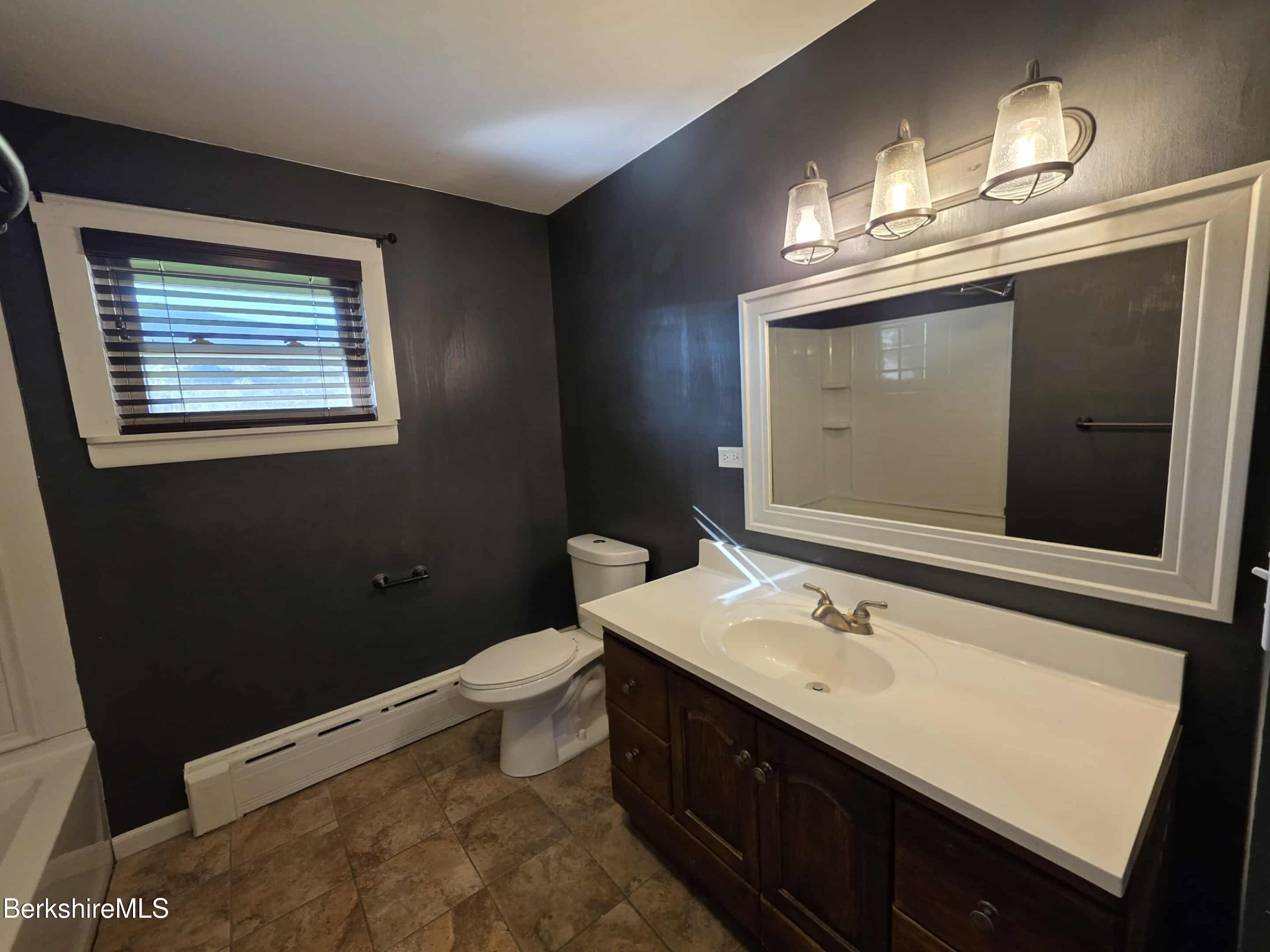 52 Richmond Street Adams, MA 01220 - Photo 14 of 25 a bathroom with a sink vanity and a mirror