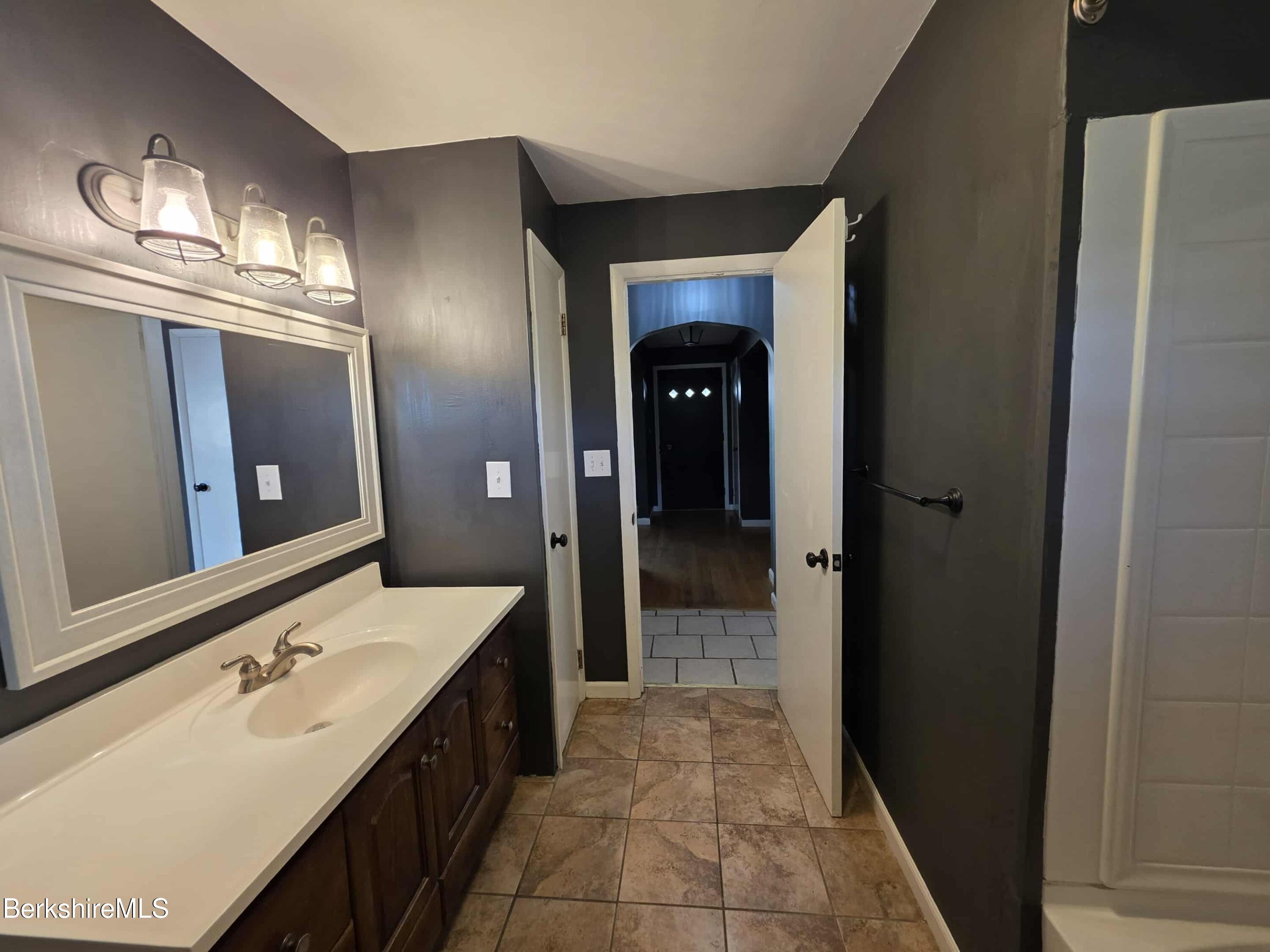 52 Richmond Street Adams, MA 01220 - Photo 16 of 25 a bathroom with a sink a toilet and shower