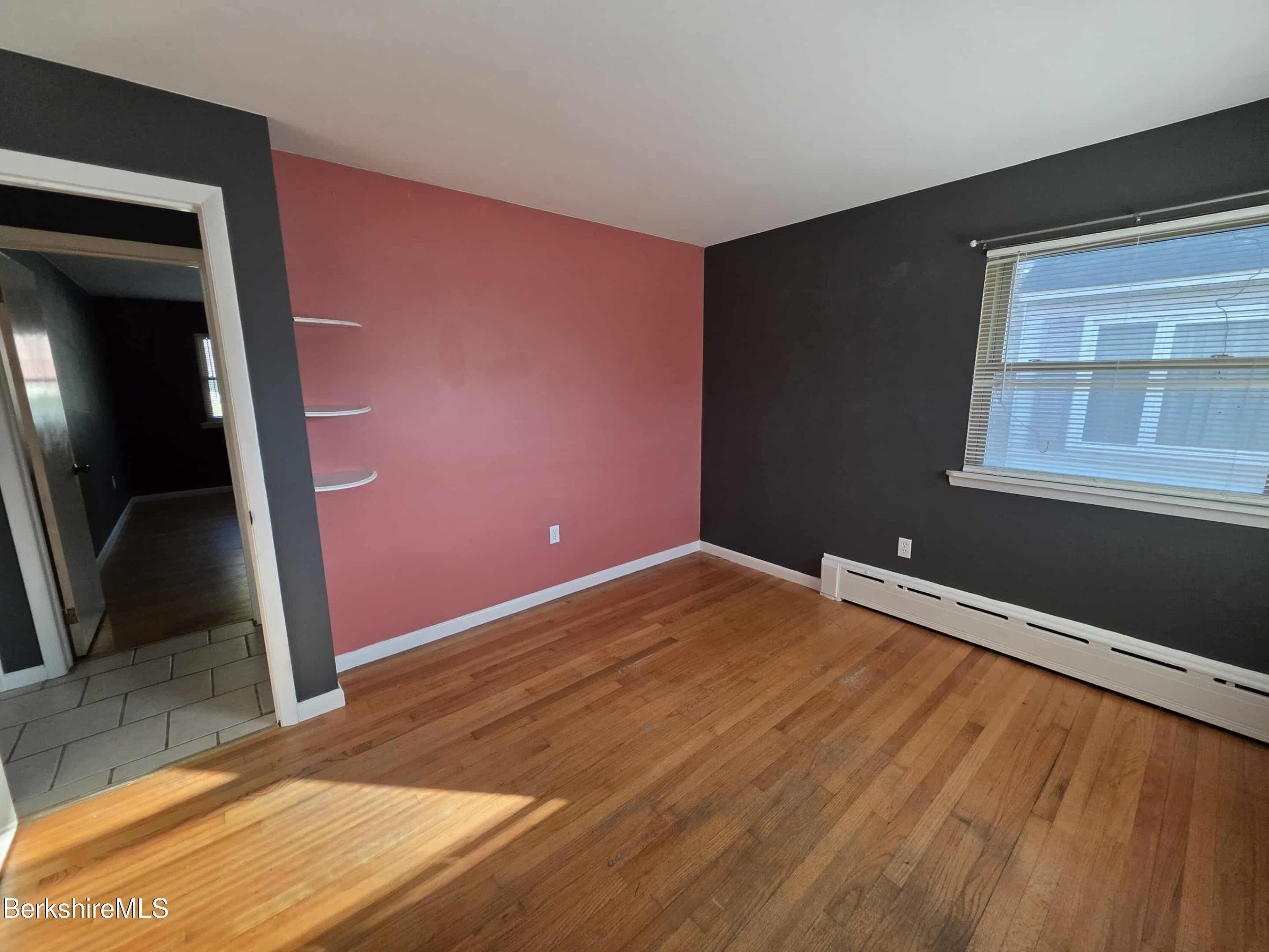 52 Richmond Street Adams, MA 01220 - Photo 20 of 25 a view of an empty room with wooden floor and a window