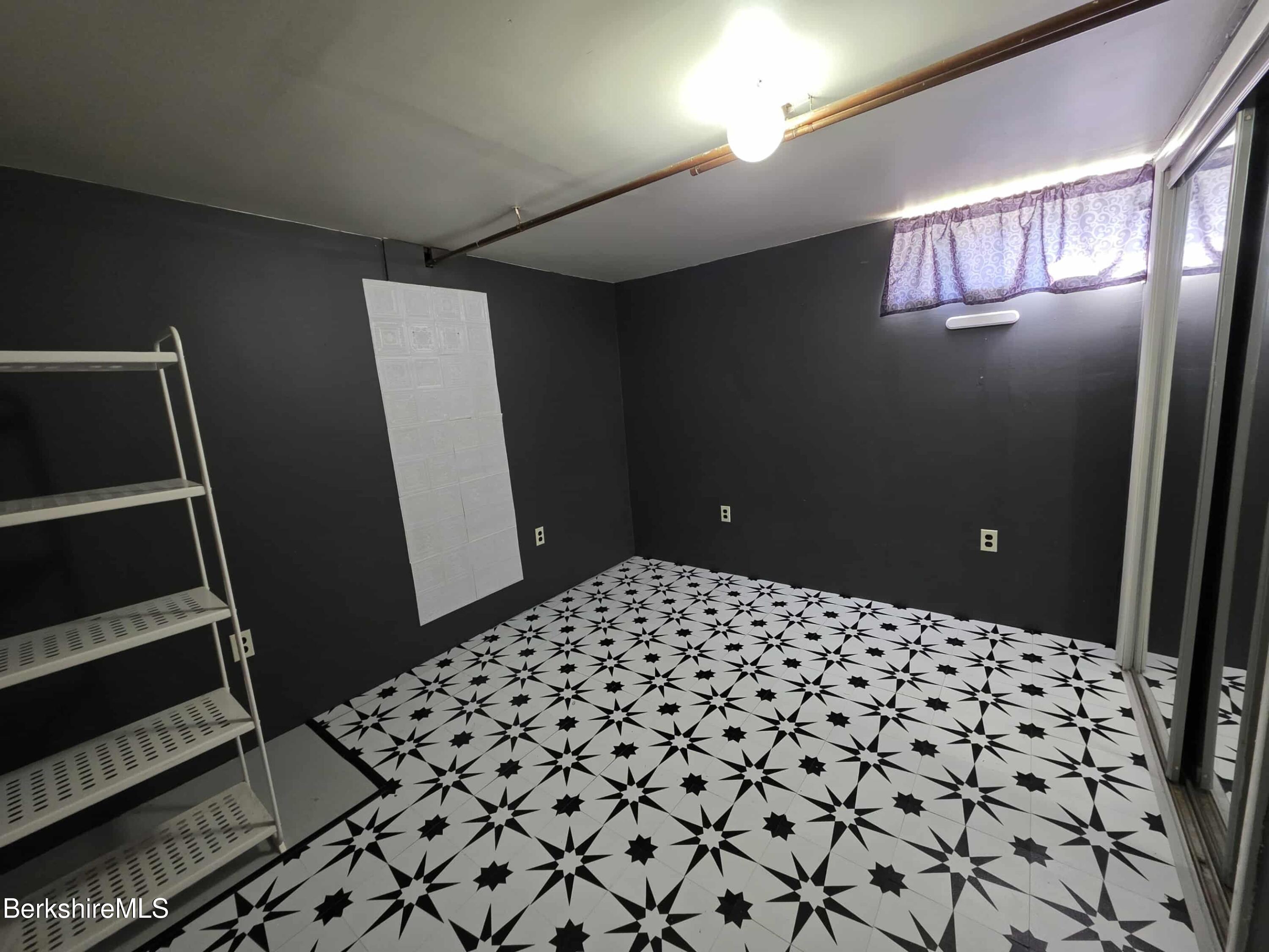 52 Richmond Street Adams, MA 01220 - Photo 23 of 25 a bedroom with a sink and a mirror