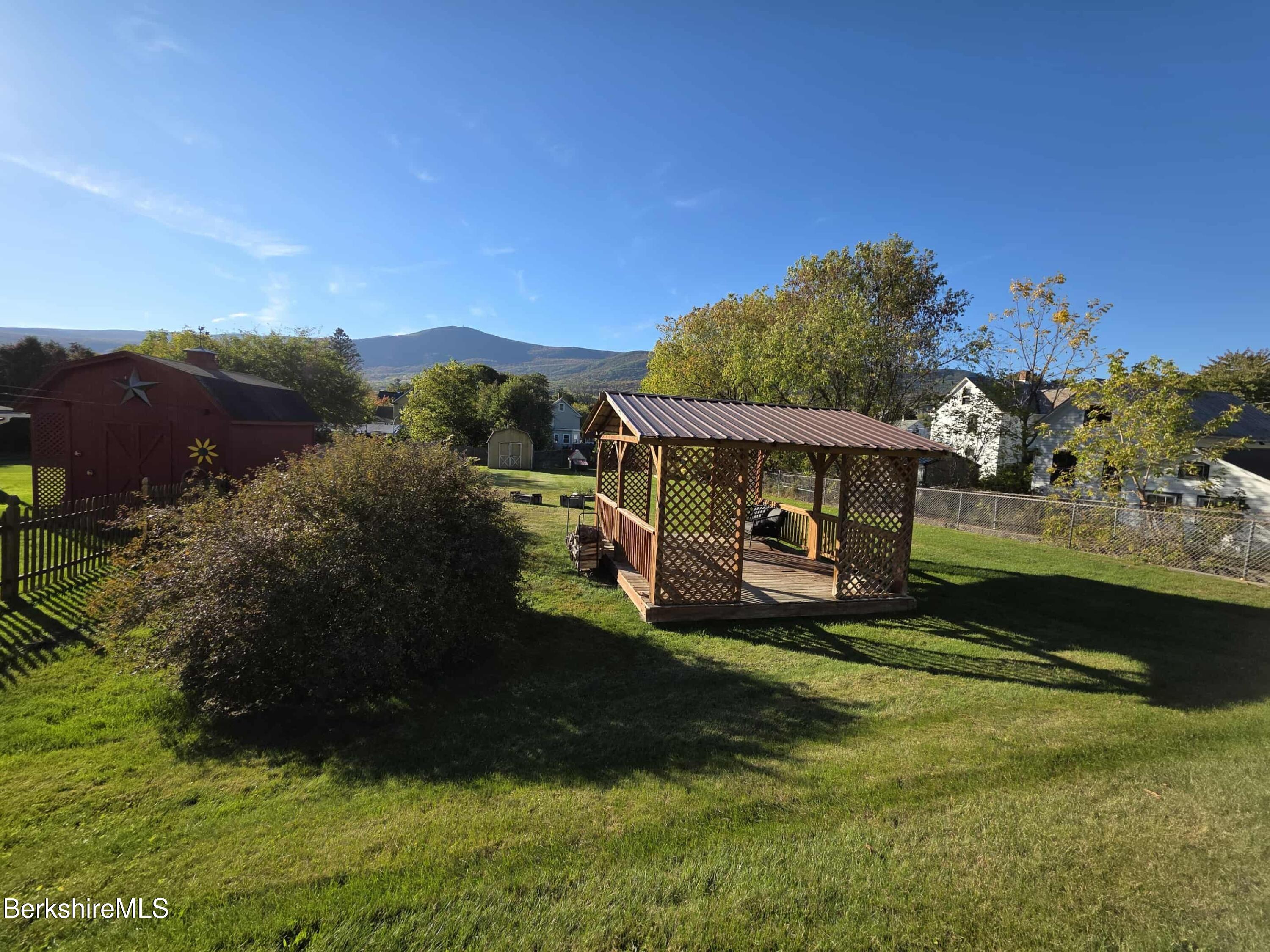 52 Richmond Street Adams, MA 01220 - Photo 4 of 25 a view of a garden with a house in the background