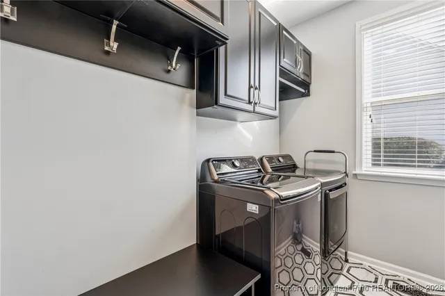 a bathroom with a granite countertop sink a toilet and a large mirror