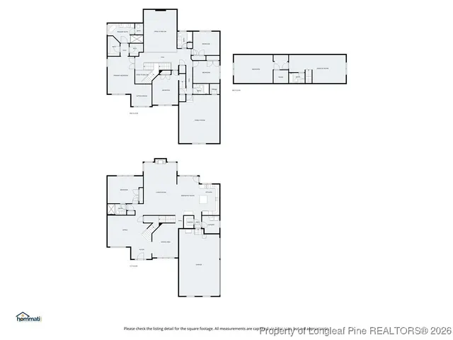 a living room with furniture flowerpot and wooden floor