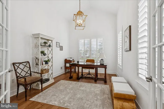 a view of a livingroom with furniture and a window