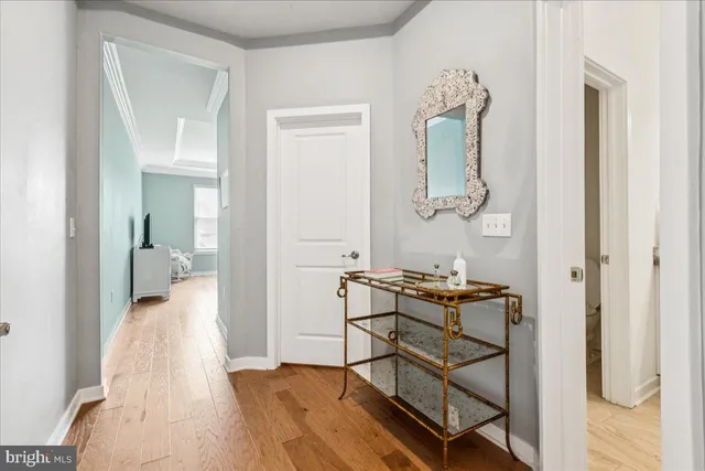 a bedroom with a bed and chandelier