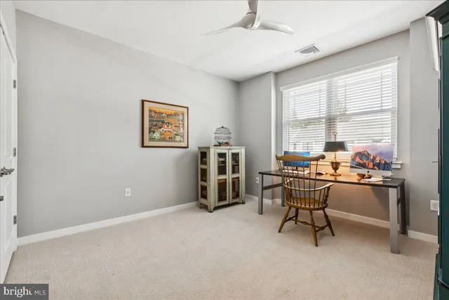 a work room with furniture and a window
