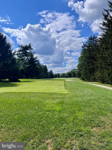 a view of a big yard with a house