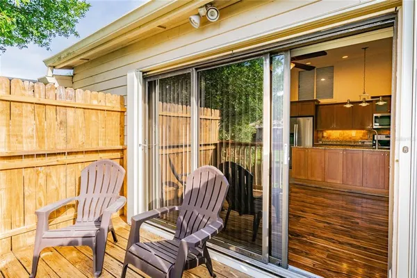 a view of a balcony with wooden floor