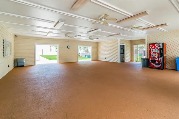 a view of a livingroom with furniture and a ceiling fan