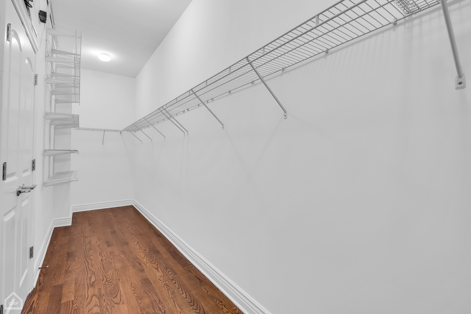 1248 West Jackson Boulevard, Unit 3E Chicago, IL 60607 - Photo 15 of 20 a view of a room with racks on the wall