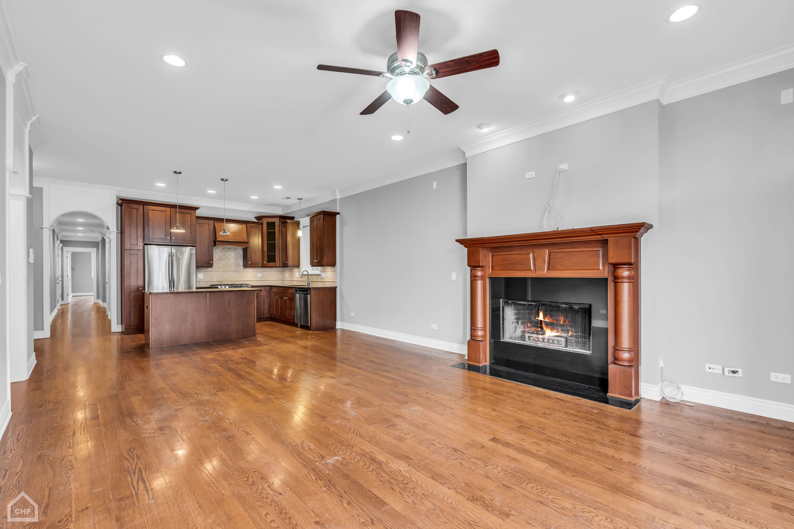 1248 West Jackson Boulevard, Unit 3E Chicago, IL 60607 - Photo 2 of 20 a view of a kitchen and a fireplace
