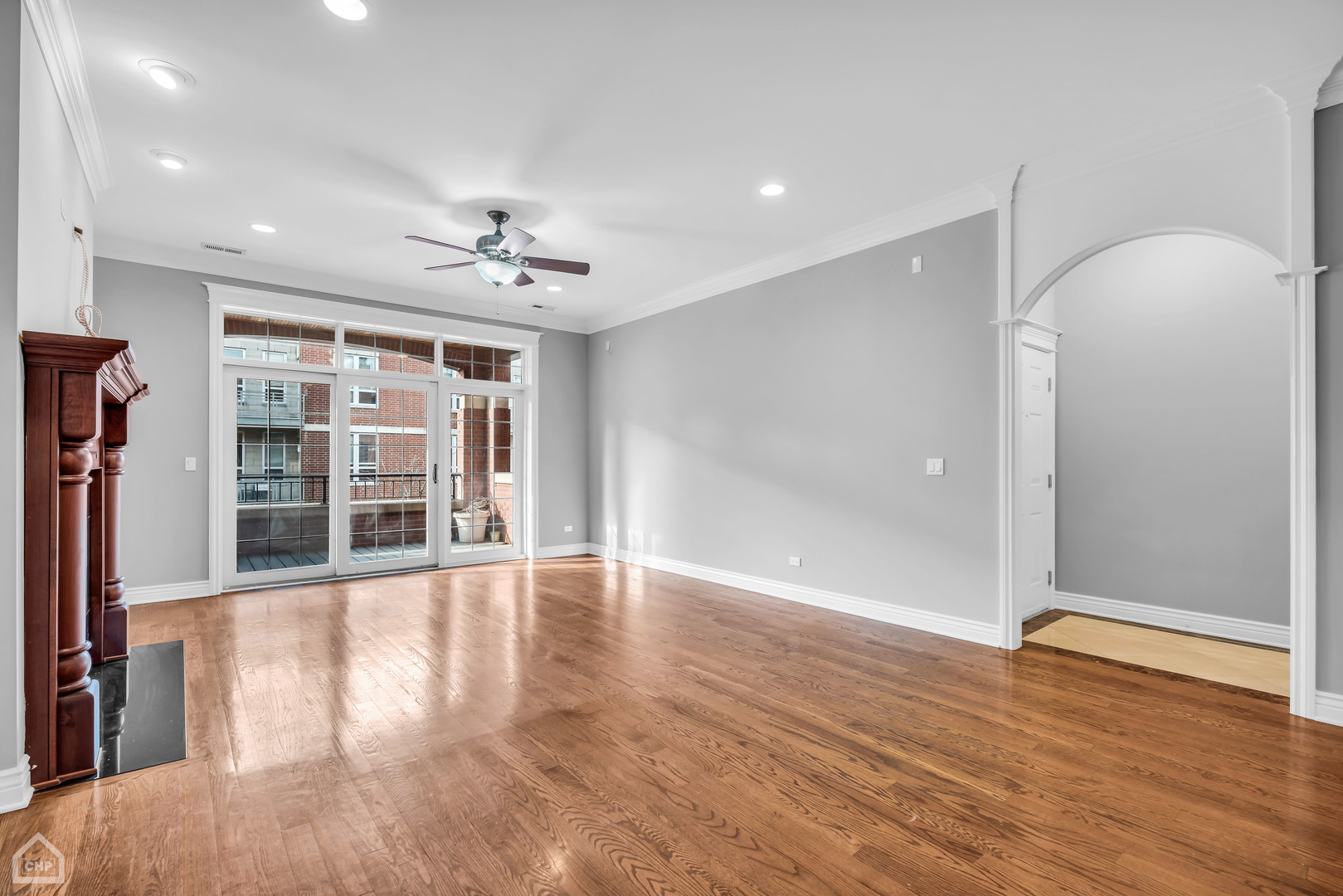 1248 West Jackson Boulevard, Unit 3E Chicago, IL 60607 - Photo 3 of 20 wooden floor in an empty room with a window