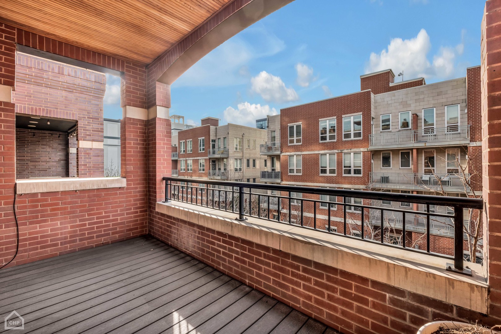 1248 West Jackson Boulevard, Unit 3E Chicago, IL 60607 - Photo 10 of 20 a view of a large building from a balcony