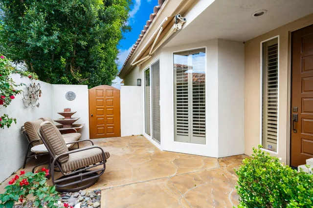 a view of backyard with seating space