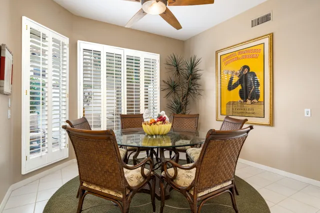 a dining room with furniture and window