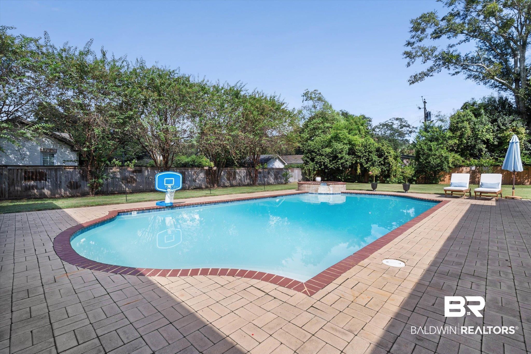 254 Woodlands Avenue Mobile, AL 36607 - Photo 2 of 50 View of pool featuring a fenced backyard and a patio area