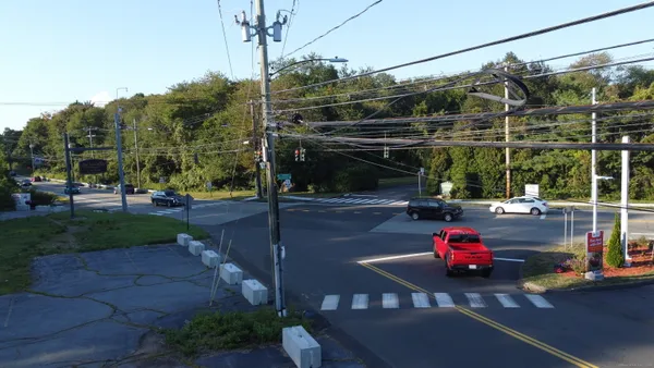 a view of a street with cars