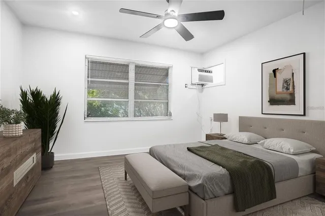 a bedroom with a bed and a window