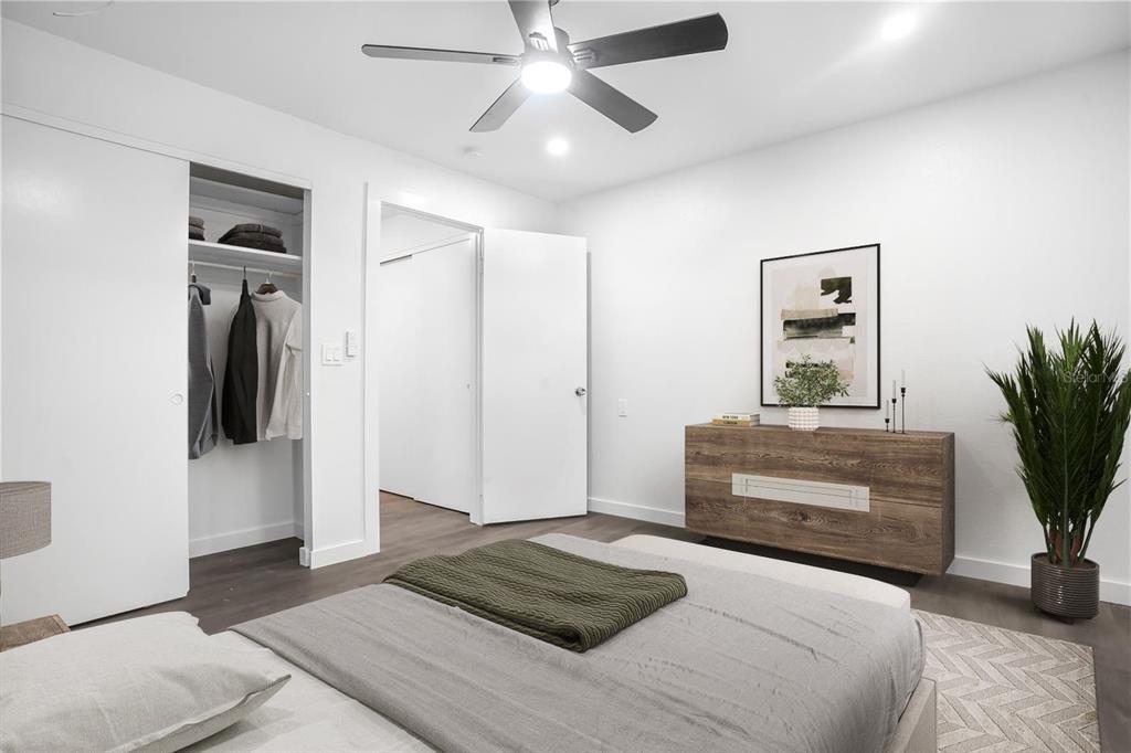 1522 Pleasant Road, Unit G23 Bradenton, FL 34207 - Photo 17 of 27 a bedroom with a bed and a potted plant