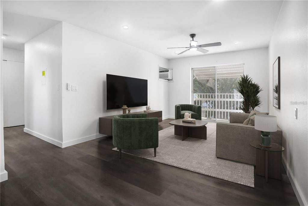 1522 Pleasant Road, Unit G23 Bradenton, FL 34207 - Photo 2 of 27 a living room with furniture and a flat screen tv