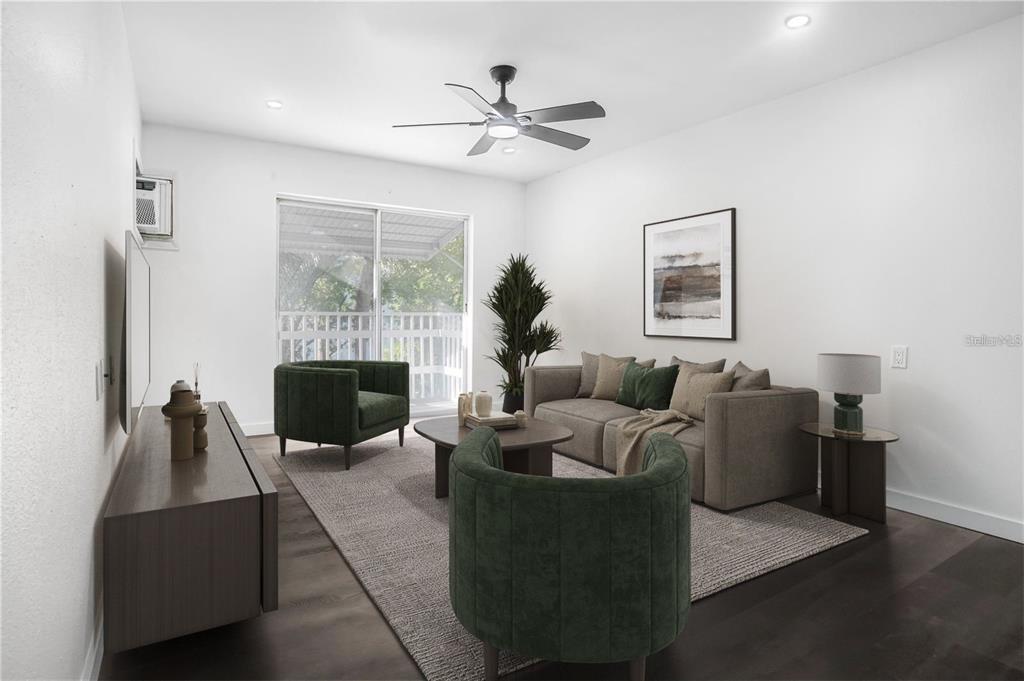 1522 Pleasant Road, Unit G23 Bradenton, FL 34207 - Photo 4 of 27 a living room with furniture a fireplace and a flat screen tv