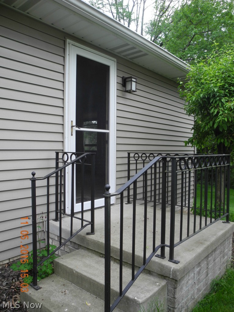 1233 Spring Valley Avenue Northwest Canton, OH 44708 - Photo 23 of 25 Private entrance to the office area to the side of home. Beautiful custom iron work enhances porch.