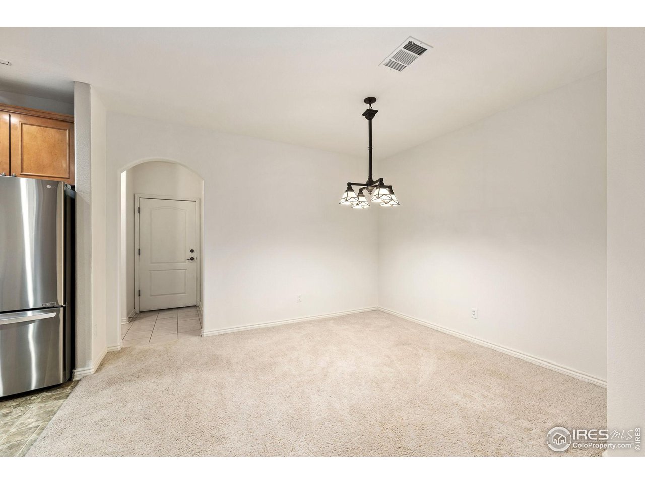 4672 West 20th Road, Unit 2212 Greeley, CO 80634 - Photo 13 of 40 The dining area is open to the kitchen and accented with designer lighting