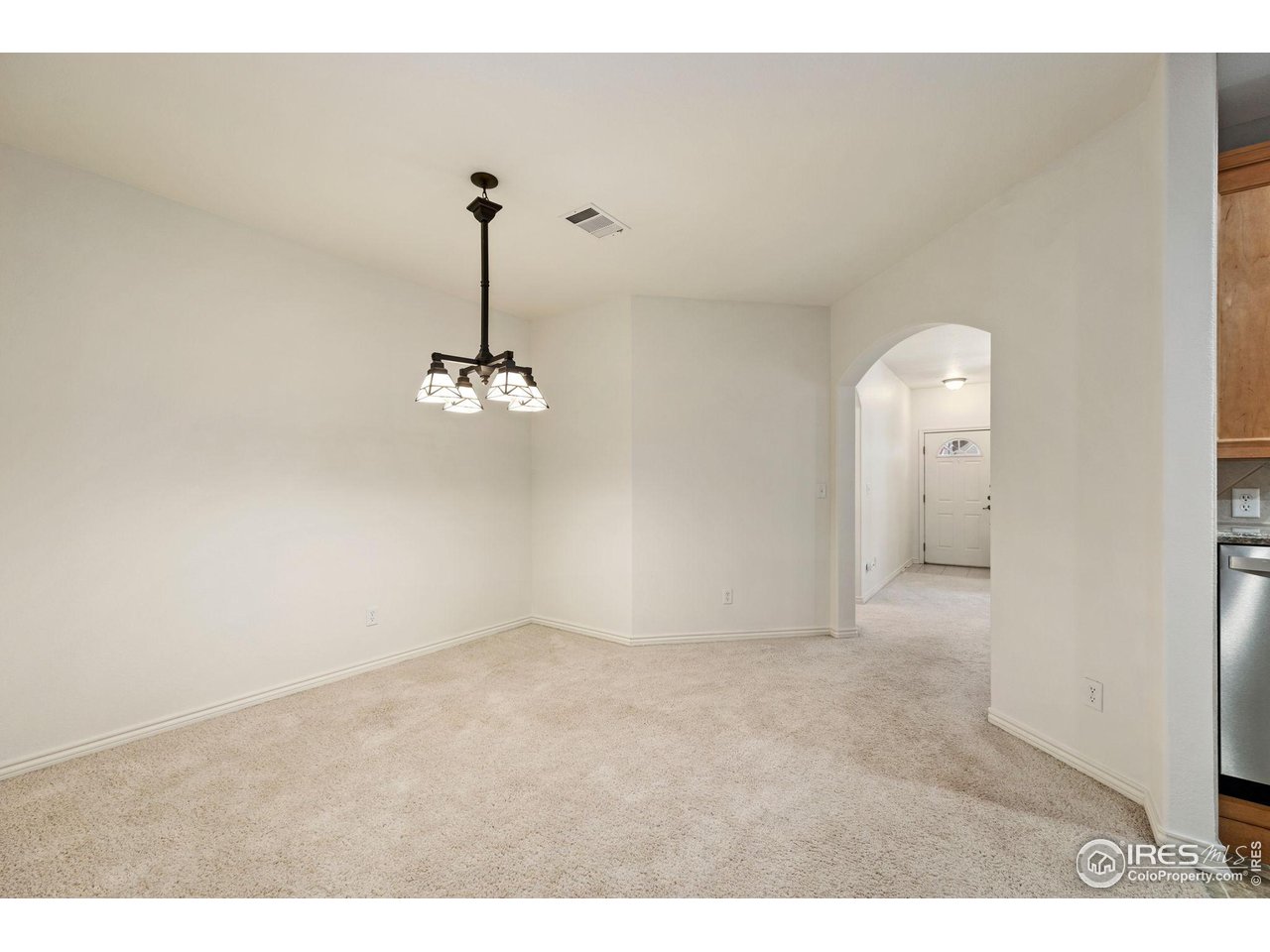 4672 West 20th Road, Unit 2212 Greeley, CO 80634 - Photo 15 of 40 The dining area is open to the kitchen and accented with designer lighting