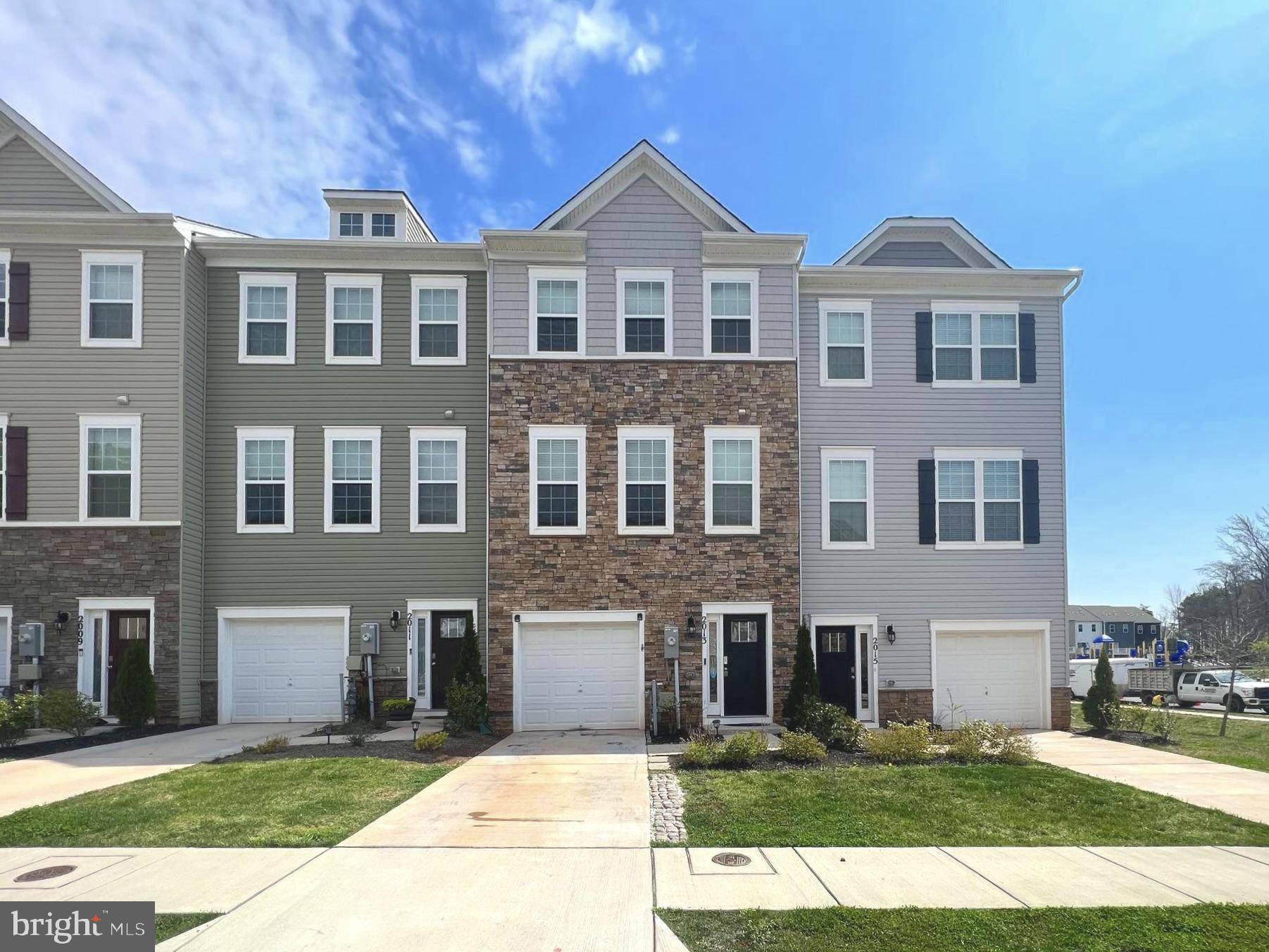 2013 Thornbrook Way Odenton, MD 21113 - Photo 1 of 17 a front view of a house with a yard
