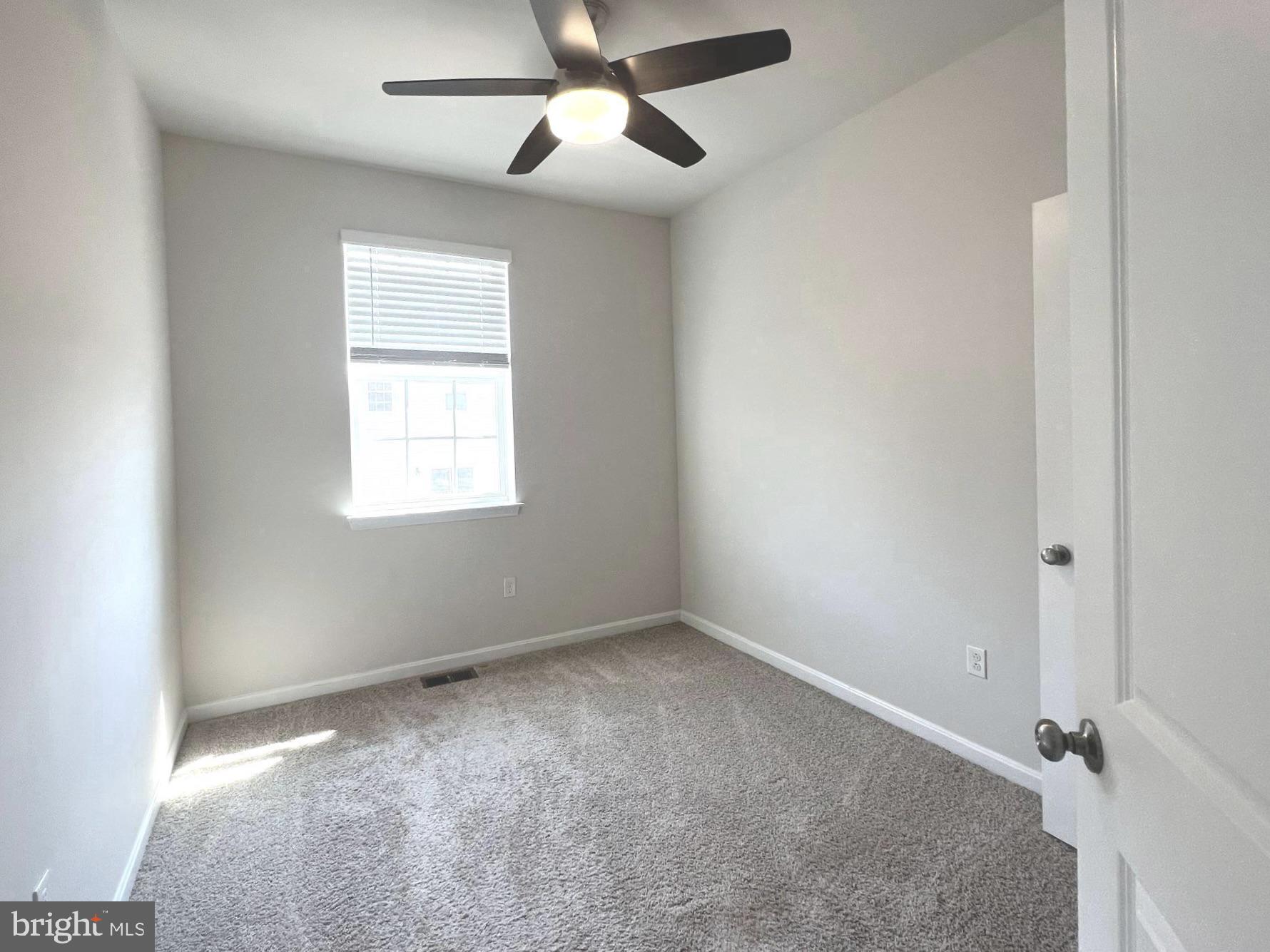 2013 Thornbrook Way Odenton, MD 21113 - Photo 12 of 17 an empty room with a window and a fan